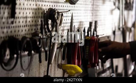 Various mechanical old tools in car service Stock Photo