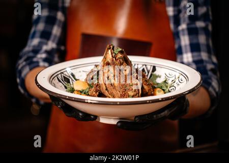 Cooked Lamb Ribs Seasoned with Parsley. Stock Photo