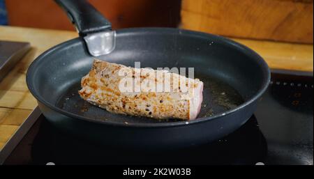 https://l450v.alamy.com/450v/2k2w03b/pork-meat-frying-in-hot-pan-close-up-seasoning-with-falling-herbs-on-fresh-fried-pork-meat-2k2w03b.jpg