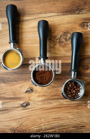 Different processes of preparing coffee by a barista in a coffee shop. Coffee beans, ground, ready. Coffee art concept. Stock Photo