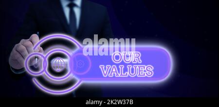 Conceptual caption Our Values. Business concept list of morals companies or individuals commit to do them Businessman in suit holding notepad symbolizing successful teamwork. Stock Photo