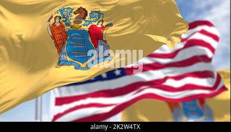 The New Jersey state flag waving along with the national flag of the United States of America Stock Photo