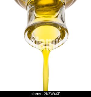 Oil pouring from a bottle Stock Photo