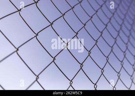 Metal fence with sky Stock Photo