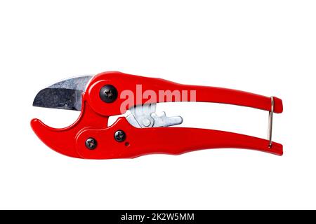 Plumber tools isolated. Closeup of a red PVC pipe cutter for cutting plastic pipes isolated on a white background. Clipping path. Macro. Craftsman tools. Stock Photo