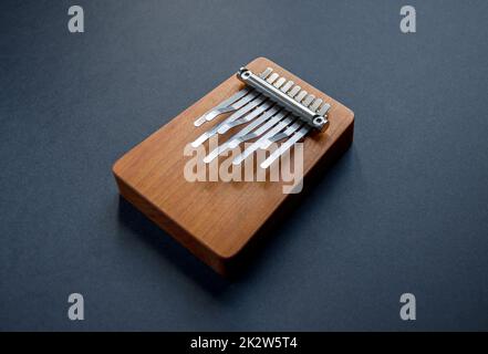 Traditional wooden kalimba isolated on black Stock Photo