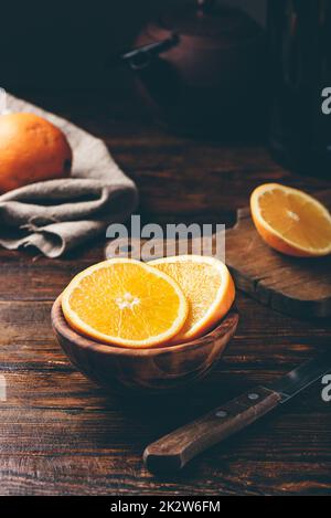 Slices of orange in a rustic bowl Stock Photo