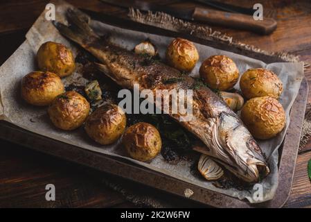 Fish Baked with Sorrel and New Potatoes Stock Photo