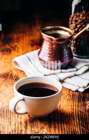 Cup of turkish coffee on wooden table Stock Photo