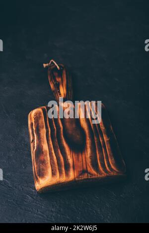 Cutting Board with Handle on Concrete Surface Stock Photo