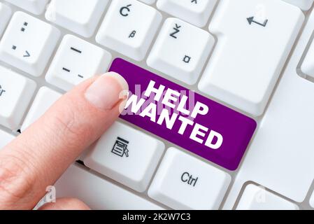 Sign displaying Help Wanted. Concept meaning advertisement placed in newspaper by employers seek employees -48919 Stock Photo