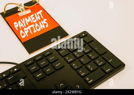 Conceptual caption Payment Options. Internet Concept The way of chosen to compensate the seller of a service Computer Keyboard And Symbol.Information Medium For Communication. Stock Photo