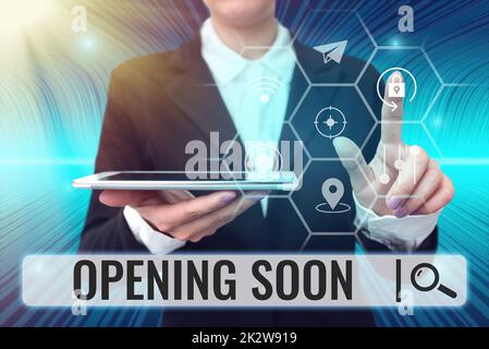 Writing displaying text Opening Soon. Business idea Going to be available or accessible in public anytime shortly Lady holding tablet symbolizing successful teamwork accomplishments. Stock Photo