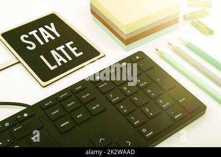 Text sign showing Stay Late. Business approach A routine in which a person goes to somewhere out of time Businessman in suit holding open palm symbolizing successful teamwork. Stock Photo