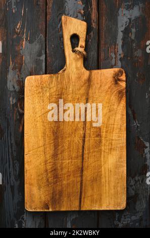 Wooden cutting board, handmade wood cutting board on wooden craft table. Stock Photo