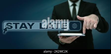 Text sign showing Stay Late. Concept meaning A routine in which a person goes to somewhere out of time Lady in suit holding pen symbolizing successful teamwork accomplishments. Stock Photo