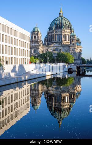 The Berliner Dom with the rebuilt City Palace reflected in the river Spree Stock Photo