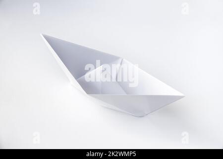 Paper boat origami isolated on a white background Stock Photo