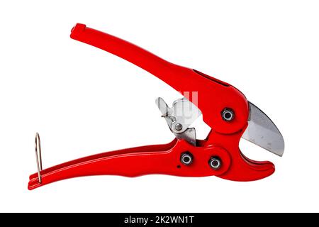 Plumber tools isolated. Closeup of a red PVC pipe cutter for cutting PE pressure pipe or water pipe isolated on a white background. Clipping path. Macro. Craftsman tools. Stock Photo