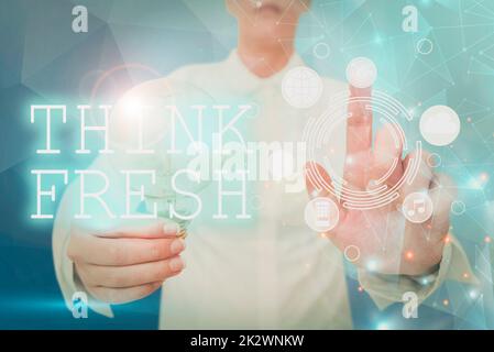 Text caption presenting Think Fresh. Internet Concept Thinking on natural ingredients Positive good environment Lady holding light bulb pointing finger upwards symbolizing success. Stock Photo