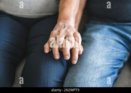 Happy romantic senior couple in love holding hands Stock Photo