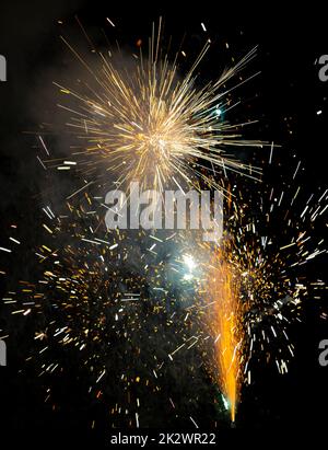 Fireworks in evening sky during celebration for New Year Stock Photo