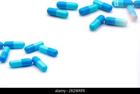Blue antibiotic capsule pills on white background. Prescription drugs. Antibiotic drug resistance. Antimicrobial capsule pills. Pharmaceutical industry. Healthcare and medicine. Pharmacy product. Stock Photo
