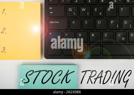 Text sign showing Stock Trading. Internet Concept Buy and Sell of Securities Electronically on the Exchange Floor Computer Keyboard And Symbol.Information Medium For Communication. Stock Photo