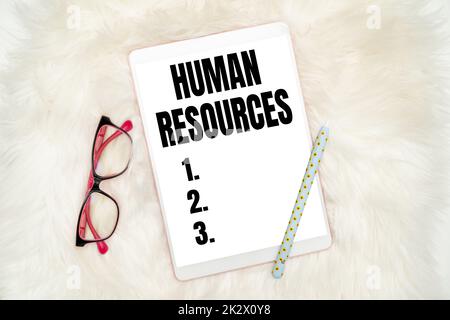Handwriting text Human Resources. Business concept The showing who make up the workforce of an organization Office Supplies Over Desk With Keyboard And Glasses And Coffee Cup For Working Stock Photo