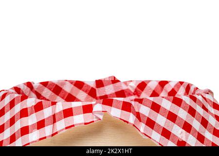 Empty picnic basket. Close-up of a empty straw basket therein a red checkered napkin isolated on a white background. For your food and product display montage. Macro. Stock Photo