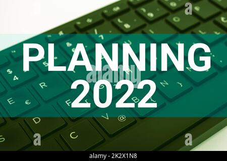 Inspiration showing sign Planning 2022. Concept meaning Begin with end in the Mind Positioning Long term Objectives Computer Keyboard And Symbol.Information Medium For Communication. Stock Photo