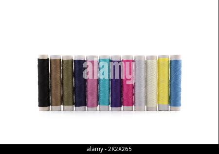 Colourful thread spools on white background with clipping path Stock Photo