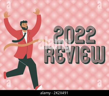 Conceptual caption 2022 Review. Internet Concept seeing important events or actions that made previous year Gentleman In Suit Running Towards Finish Line Celebrating Success Stock Photo