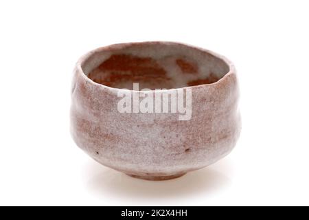 Single tea bowl used in Japanese matcha tea ceremony on white background Stock Photo