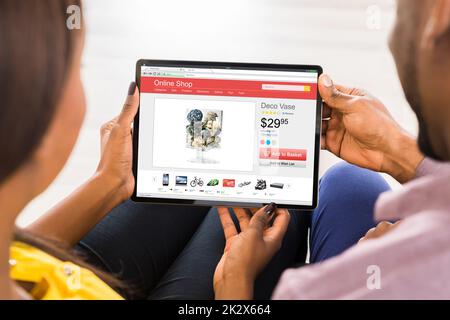 Young Couple Using Digital Tablet Stock Photo