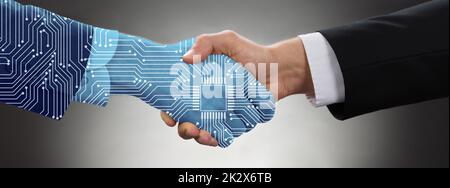 Businessman Shaking Hands In Front Of Mallet Stock Photo