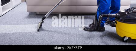 Janitor Cleaning Carpet Stock Photo