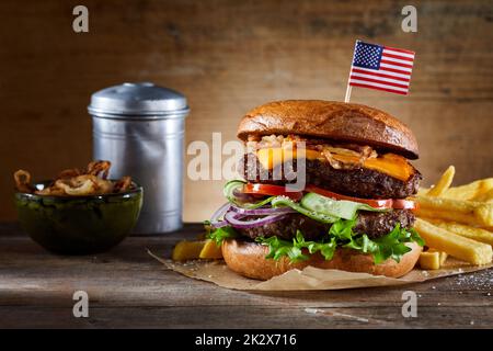 Burger with American flag skewer and fries Stock Photo