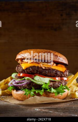 Burger with cutlets on table Stock Photo
