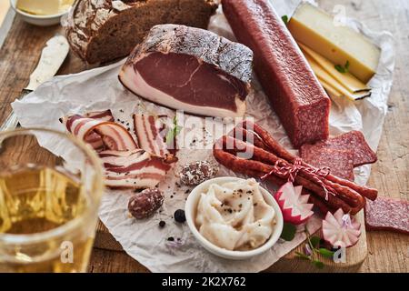 Smoked lard and sausages on table Stock Photo