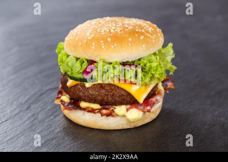 Hamburger Cheeseburger fastfood fast food on a slate Stock Photo
