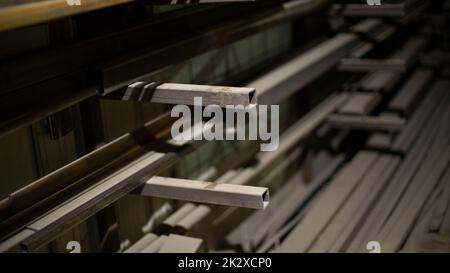 Steel profile on shelves. Metal storage details. Warehouse in shop. Stock Photo