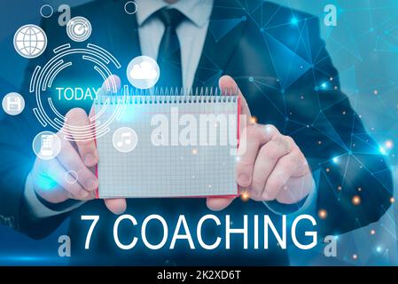 Text showing inspiration 7 Coaching. Word Written on Refers to a number of figures regarding business to be succesful Businessman in suit holding notepad symbolizing successful teamwork. Stock Photo