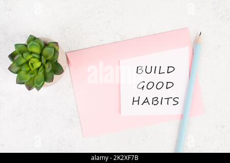 The words build good habits are standing on a paper, change lifestyle, healthy and positive attidude, motivation concept Stock Photo