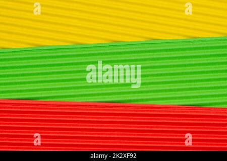 Striped colorful embossed paper. Yellow,green and red. Stock Photo