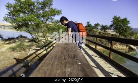Man leaning on a railing Stock Photo