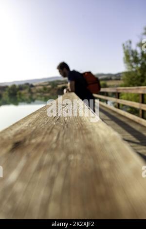 Man leaning on a railing Stock Photo