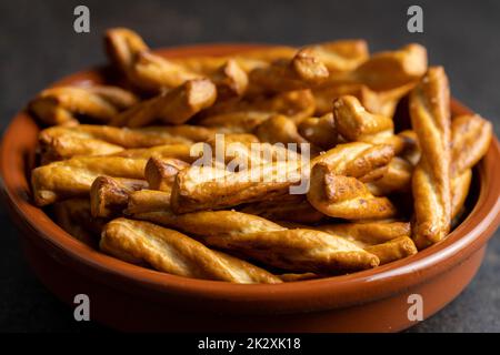 Salted pretzel sticks. Salted crackers in bowl. Stock Photo