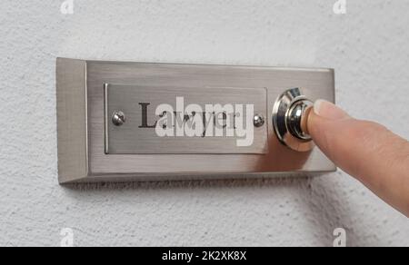 Doorbell sign with the engraving Lawyer Stock Photo