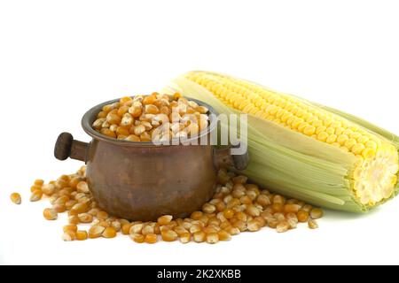 Corn kernels and fresh maize or corn on the cob Stock Photo